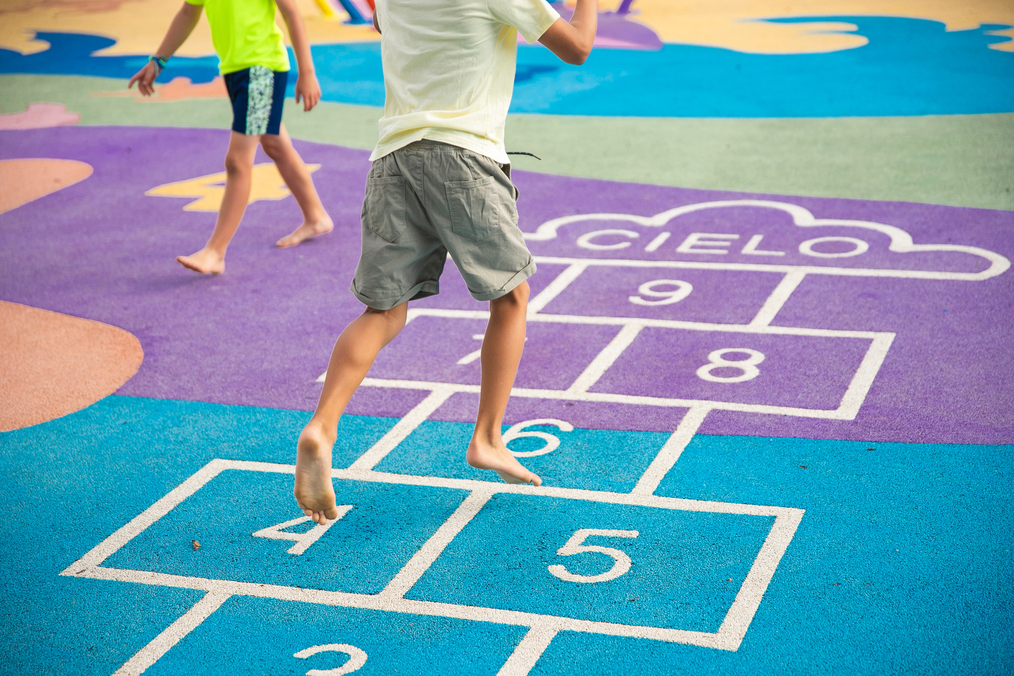 Boy Playing Hopscotch